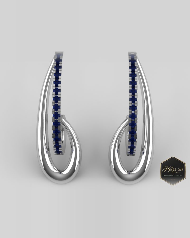 Elongated open-drop white metal earrings set with a channel of blue sapphires