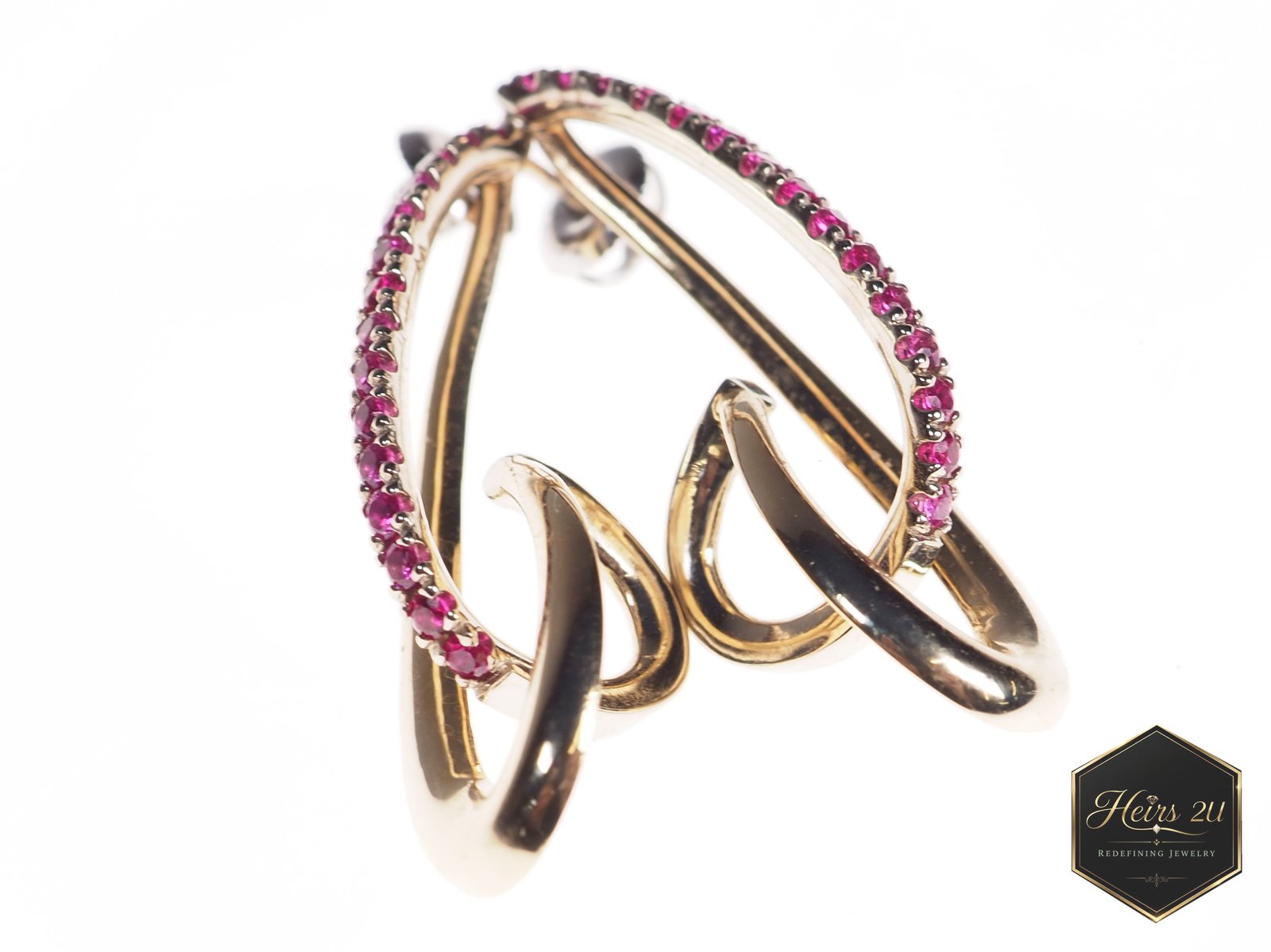 The Jacque Earring — an interlocking rose gold ear climber set with pink stones