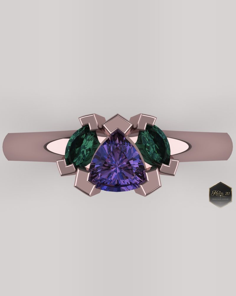 Rose gold ring with a purple trillion centre stone flanked by two marquise emeralds